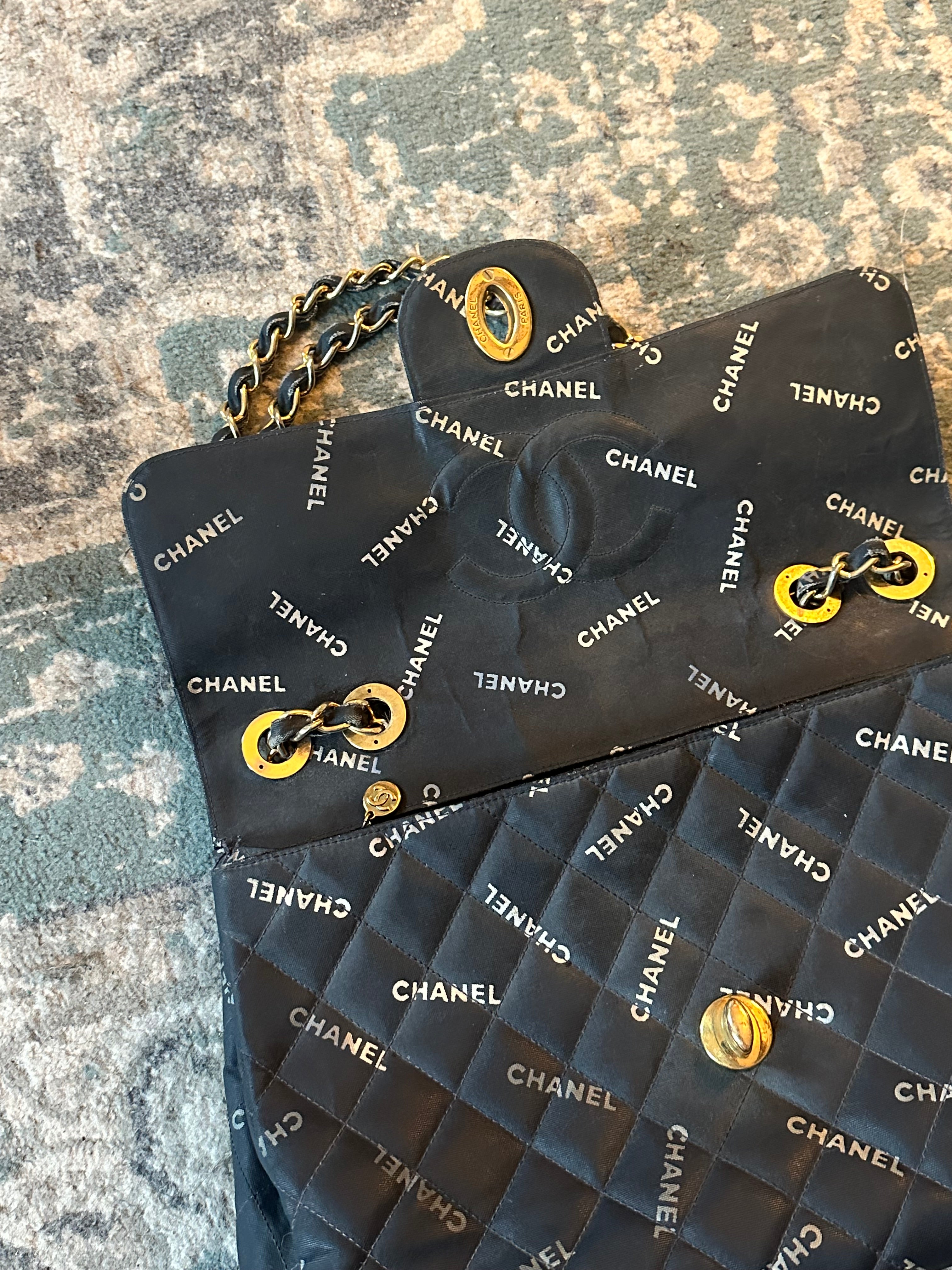 Chanel Black Quilted Canvas Logo Print Maxi XL Flap Bag