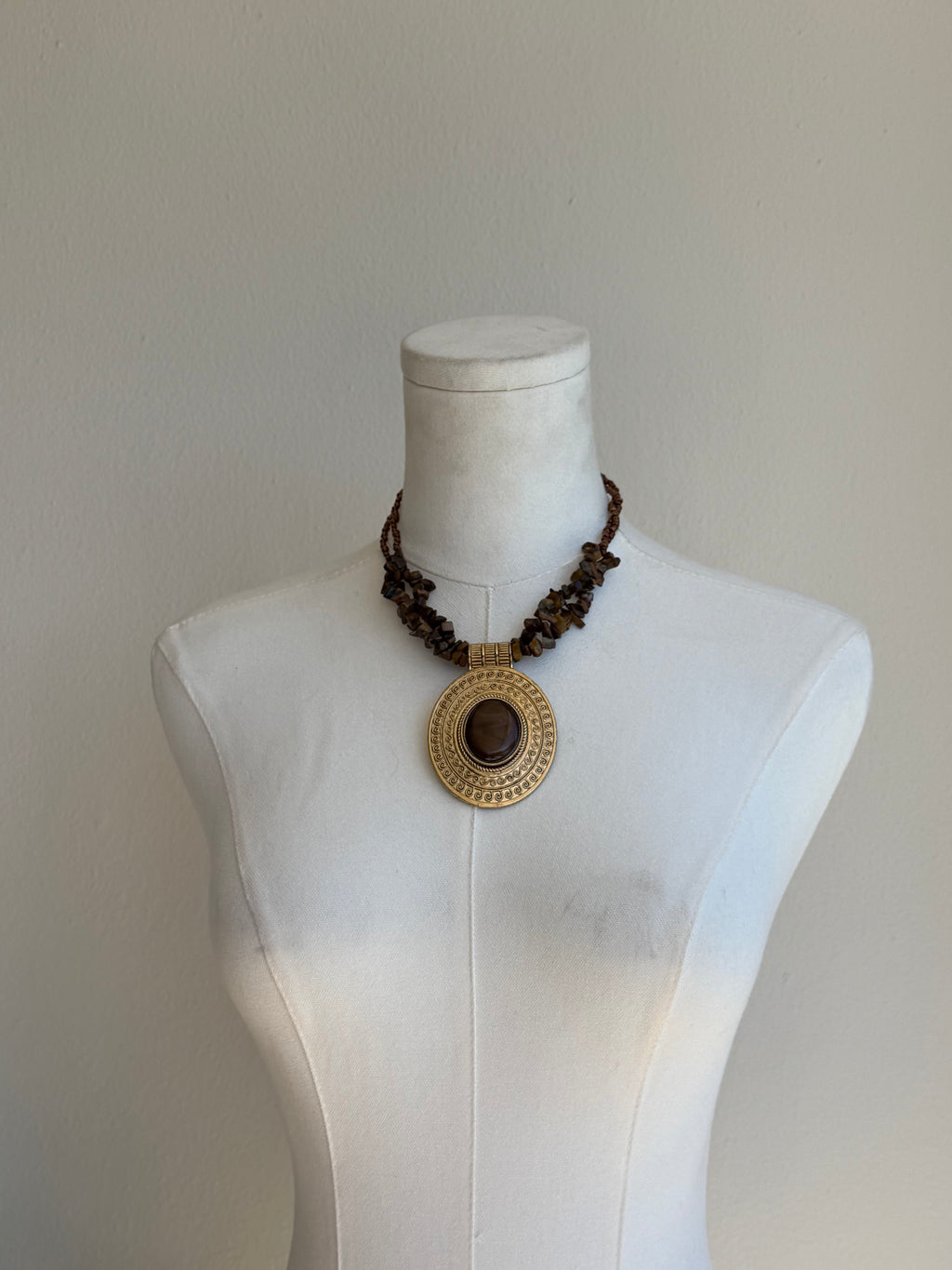 Gold medallion stone necklace
