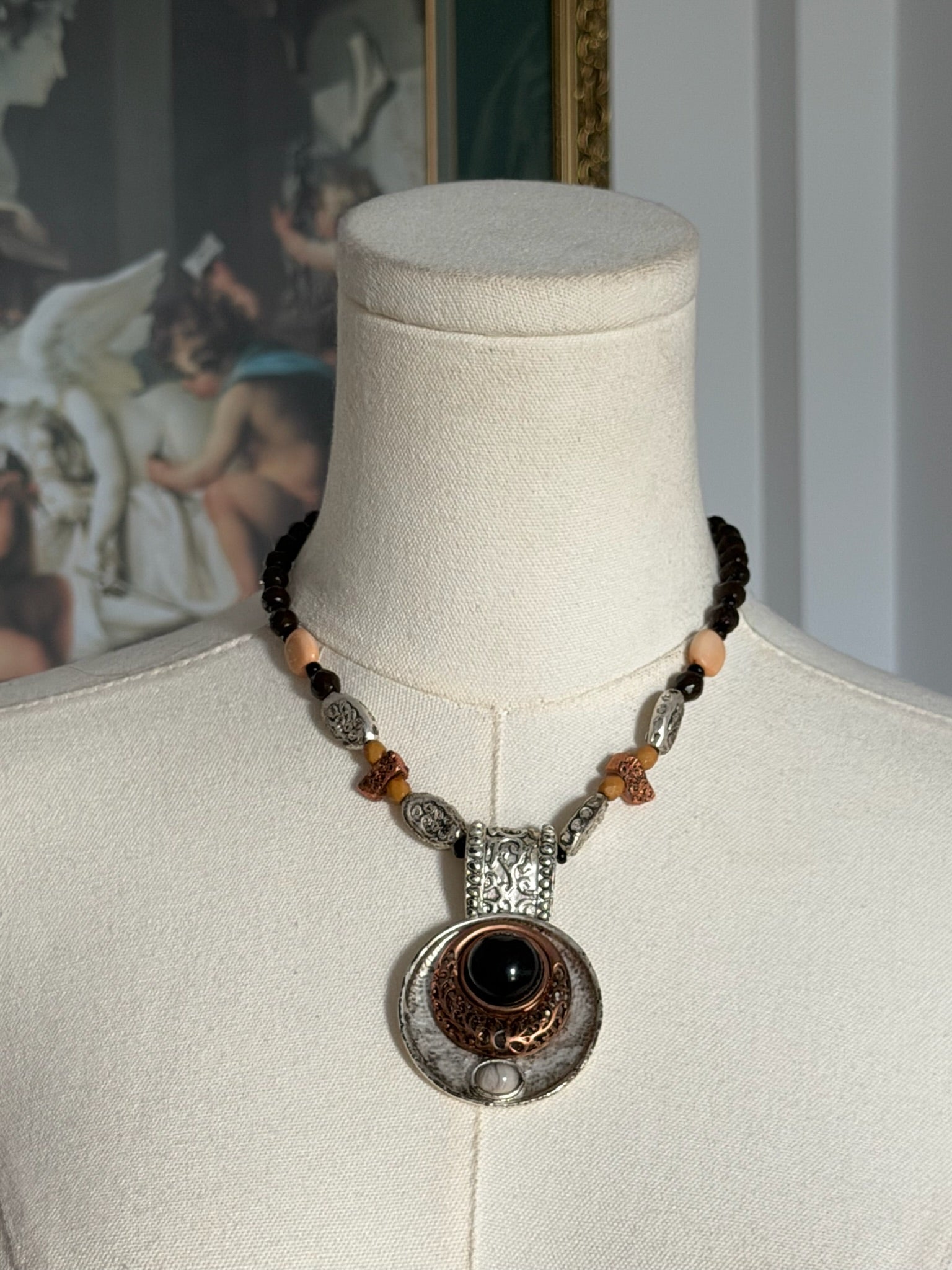 Mixed metal pendant necklace