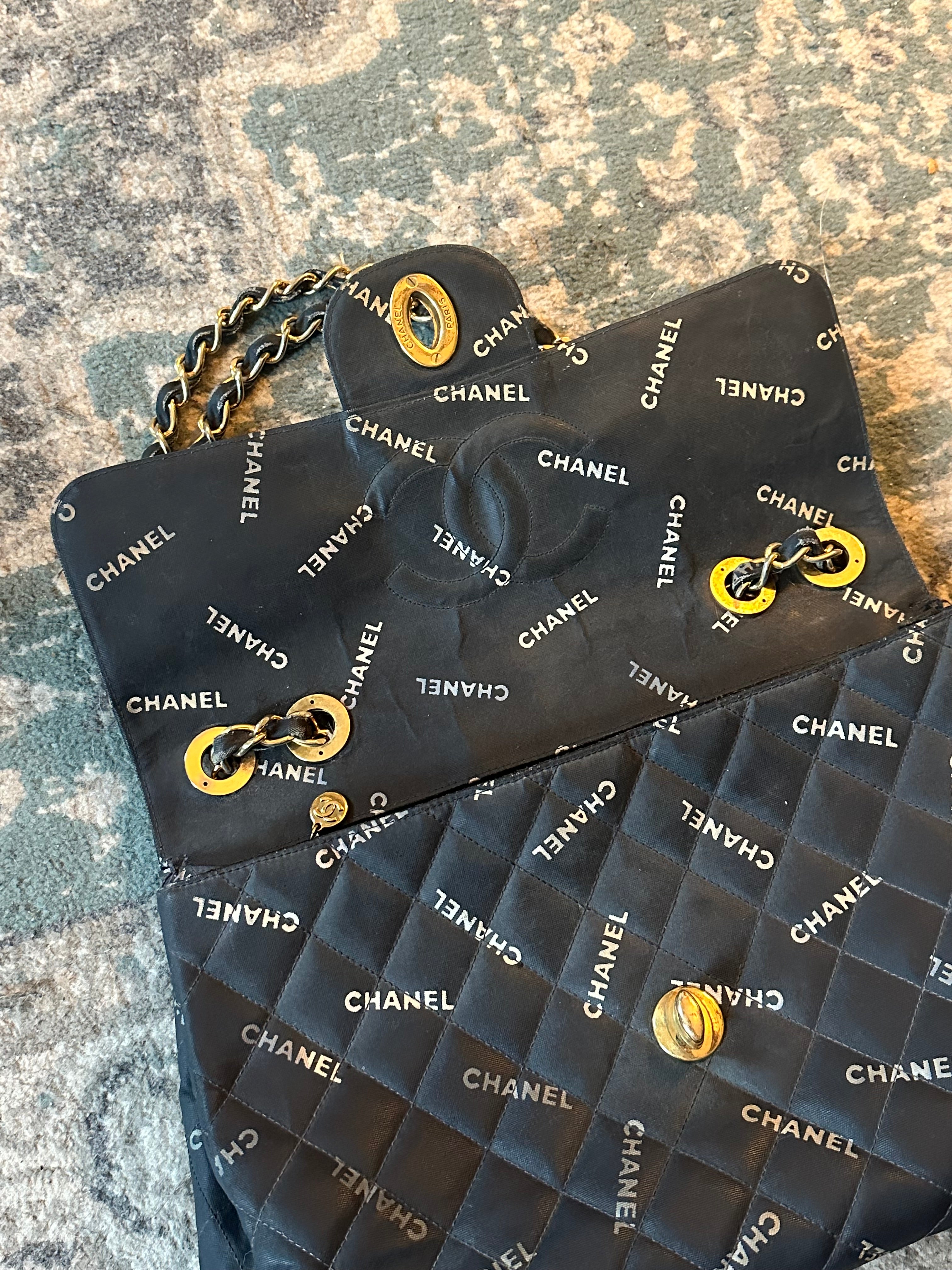 Chanel Black Quilted Canvas Logo Print Maxi XL Flap Bag
